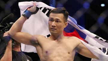 Dec 21, 2019; Busan, SOUTH KOREA; Chan Sung Jung (blue gloves) defeats Frankie Edgar (red gloves) during UFC Fight Night at Sajik Arena. Mandatory Credit: Jasmin Frank-USA TODAY Sports
