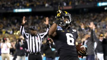 SAN DIEGO, CALIFORNIA - DECEMBER 27: Ihmir Smith-Marsette #6 of the Iowa Hawkeyes returns a kickoff 98 yards for a touchdown during the first half of the San Diego County Credit Union Holiday Bowl against the USC Trojans at SDCCU Stadium on December 27, 2019 in San Diego, California. (Photo by Sean M. Haffey/Getty Images)