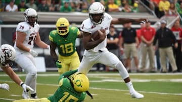 EUGENE, OR - SEPTEMBER 02: Quarterback Patrick Tyler #3 of the Southern Utah Thunderbirds breaks the tackle attempt by safety Fotu T. Leiato II #19 of the Oregon Ducks on his way to score a touchdown in the first quarter of the game at Autzen Stadium on September 2, 2017 in Eugene, Oregon. (Photo by Steve Dykes/Getty Images)