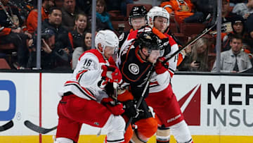 ANAHEIM, CA - DECEMBER 11: Ondrej Kase #25 of the Anaheim Ducks battles for position against Marcus Kruger #16 and Jaccob Slavin #74 of the Carolina Hurricanes during the game on December 11, 2017 at Honda Center in Anaheim, California. (Photo by Debora Robinson/NHLI via Getty Images)