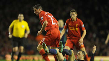 LIVERPOOL, ENGLAND - JANUARY 02: Jamie Carragher of Liverpool tangles with Steven Fletcher of Sunderland during the Barclays Premier League match between Liverpool and Sunderland at Anfield on January 2, 2013 in Liverpool, England. (Photo by Chris Brunskill/Getty Images)