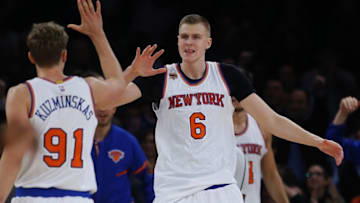 Nov 16, 2016; New York, NY, USA; New York Knicks forward Mindaugas Kuzminskas (91) and forward Kristaps Porzingis (6) react after scoring a basket against the Detroit Pistons during first half at Madison Square Garden. Mandatory Credit: Noah K. Murray-USA TODAY Sports