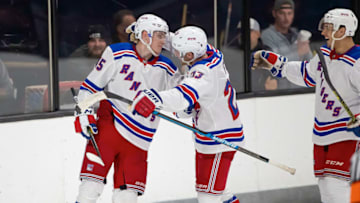 TRAVERSE CITY, MI - SEPTEMBER 09: Kaapo Kakko #45 of the New York Rangers celebrates his game winning O.T. goal against the Minnesota Wild with teammates Adam Fox #23 and Ryan Dmowski #58 during Day-4 of the NHL Prospects Tournament at Centre Ice Arena on September 9, 2019 in Traverse City, Michigan. The New York Rangers defeated the Minnesota Wild 4-3 in O.T. (Photo by Dave Reginek/NHLI via Getty Images)
