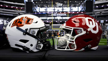 Jul 12, 2023; Arlington, TX, USA; A view of the Oklahoma State Cowboys and Oklahoma Sooners helmets and logos during Big 12 football media day at AT&T Stadium. Mandatory Credit: Jerome Miron-USA TODAY Sports