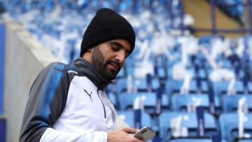 LEICESTER, ENGLAND - DECEMBER 16: Riyad Mahrez of Leicester City checks his phone prior to the Premier League match between Leicester City and Crystal Palace at The King Power Stadium on December 16, 2017 in Leicester, England. (Photo by Matthew Lewis/Getty Images)