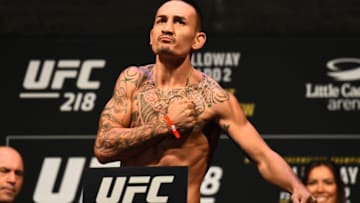 DETROIT, MI - DECEMBER 01: Max Holloway poses on the scale during the UFC 218 weigh-in inside Little Caesars Arena on December 1, 2017 in Detroit, Michigan. (Photo by Josh Hedges/Zuffa LLC/Zuffa LLC via Getty Images)