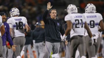 CHAMPAIGN, IL - NOVEMBER 25: Head coach Pat Fitzgerald of the Northwestern Wildcats celebrates with members of the team after a score against the Illinois Fighting Illini at Memorial Stadium on November 25, 2017 in Champaign, Illinois. (Photo by Michael Hickey/Getty Images)