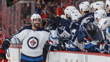 OTTAWA, ON - FEBRUARY 19: Mathieu Perreault #85 of the Winnipeg Jets smiles as he celebrates his first period goal against the Winnipeg Jets with teammates at the players bench at Canadian Tire Centre on February 19, 2017 in Ottawa, Ontario, Canada. (Photo by Andre Ringuette/NHLI via Getty Images)