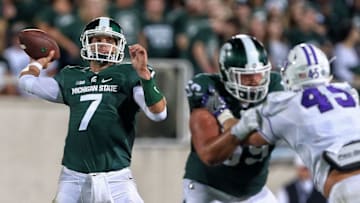 Sep 2, 2016; East Lansing, MI, USA; Michigan State Spartans quarterback Tyler O'Connor (7) prepares to throw the ball against the Furman Paladins during the second half of a game at Spartan Stadium. Mandatory Credit: Mike Carter-USA TODAY Sports