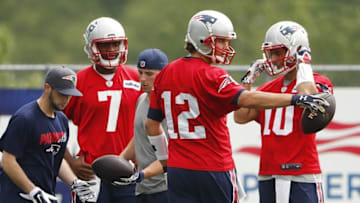 Jun 7, 2016; Foxborough, MA, USA; Ball boys prepare balls for New England Patriots quarterback Jacoby Brissett (7), quarterback Tom Brady (12) and quarterback Jimmy Garoppolo (10) during mini camp at Gillette Stadium. Mandatory Credit: Winslow Townson-USA TODAY Sports