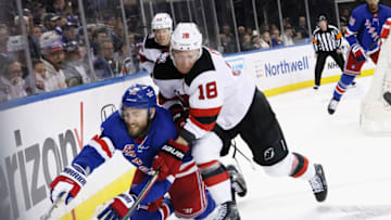 NEW YORK, NEW YORK - APRIL 22: Ondrej Palat #18 of the New Jersey Devils checks Barclay Goodrow #21 of the New York Rangers during Game Three in the First Round of the 2023 Stanley Cup Playoffs at Madison Square Garden on April 22, 2023 in New York, New York. (Photo by Bruce Bennett/Getty Images)