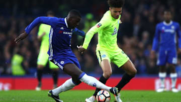 LONDON, ENGLAND - JANUARY 08: Lee Angol of Peterborough United (R) and Kurt Zouma of Chelsea (L) battle for possession during The Emirates FA Cup Third Round match between Chelsea and Peterborough United at Stamford Bridge on January 8, 2017 in London, England. (Photo by Ian Walton/Getty Images)
