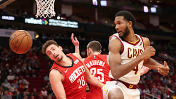 Feb 2, 2022; Houston, Texas, USA;Houston Rockets center Alperen Sengun (28) and Cleveland Cavaliers center Evan Mobley (4) watch a loose ball fall out of bounds in the second half at Toyota Center. Mandatory Credit: Thomas Shea-USA TODAY Sports