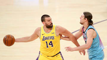 LOS ANGELES, CALIFORNIA - FEBRUARY 20: Marc Gasol #14 of the Los Angeles Lakers handles the ball guarded by Kelly Olynyk #9 of the Miami Heat at Staples Center on February 20, 2021 in Los Angeles, California. NOTE TO USER: User expressly acknowledges and agrees that, by downloading and or using this photograph, User is consenting to the terms and conditions of the Getty Images License Agreement. (Photo by Meg Oliphant/Getty Images)