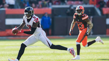 Nov 11, 2018; Cleveland, OH, USA; Atlanta Falcons wide receiver Julio Jones (11) makes a catch as Cleveland Browns strong safety Damarious Randall (23) defends during the first half at FirstEnergy Stadium. Mandatory Credit: Ken Blaze-USA TODAY Sports
