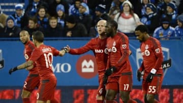 Oct 25, 2015; Montreal, Quebec, CAN; Toronto FC forward Jozy Altidore (17) reacts with teammates including Michael Bradley (4) and Sebastian Giovinco (10) after scoring a goal against the Montreal Impact during the first half at Stade Saputo. Mandatory Credit: Eric Bolte-USA TODAY Sports
