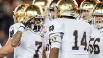 Nov 28, 2015; Stanford, CA, USA; Notre Dame Fighting Irish wide receiver William Fuller (7) gives a salute to quarterback DeShone Kizer (14) after a touchdown in the second quarter against the Stanford Cardinal at Stanford Stadium. Mandatory Credit: Matt Cashore-USA TODAY Sports