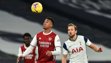 Arsenal's Brazilian defender Gabriel (C) vies with Tottenham Hotspur's English striker Harry Kane (R) during the English Premier League football match between Tottenham Hotspur and Arsenal at Tottenham Hotspur Stadium in London, on December 6, 2020. (Photo by Glyn KIRK / POOL / AFP) / RESTRICTED TO EDITORIAL USE. No use with unauthorized audio, video, data, fixture lists, club/league logos or 'live' services. Online in-match use limited to 120 images. An additional 40 images may be used in extra time. No video emulation. Social media in-match use limited to 120 images. An additional 40 images may be used in extra time. No use in betting publications, games or single club/league/player publications. / (Photo by GLYN KIRK/POOL/AFP via Getty Images)