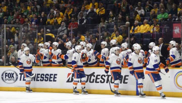 Mar 17, 2016; Nashville, TN, USA; New York Islanders players celebrate after a goal during the third period against the Nashville Predators at Bridgestone Arena. The Predators won 4-2. Mandatory Credit: Christopher Hanewinckel-USA TODAY Sports