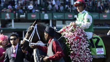 May 6, 2016; Louisville, KY, USA; Javier Castellano aboard Cathryn Sophia (12) celebrates after winning the 2016 Kentucky Oaks at Churchill Downs. Mandatory Credit: Jamie Rhodes-USA TODAY Sports