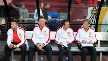 Jul 29, 2014; Landover, MD, USA; Manchester United coach Louis Van Gaal (second from left) sits with his coaches prior to the match against Inter Milan at FedEx Field. Mandatory Credit: Evan Habeeb-USA TODAY Sports