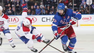 NEW YORK, NY - NOVEMBER 06: Mika Zibanejad #93 of the New York Rangers skates with the puck against Charles Hudon #54 of the Montreal Canadiens at Madison Square Garden on November 6, 2018 in New York City. The New York Rangers won 5-3. (Photo by Jared Silber/NHLI via Getty Images)