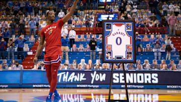 Feb 27, 2021; Lawrence, Kansas, USA; Kansas Jayhawks guard Marcus Garrett (0) is honored during a Senior Night presentation before the Kansas Jayhawks host the Baylor Bears at Allen Fieldhouse. Mandatory Credit: Amy Kontras-USA TODAY Sports