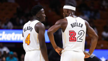 Victor Oladipo #4 and Jimmy Butler #22 of the Miami Heat talk on the court during the first half against the San Antonio Spurs(Photo by Megan Briggs/Getty Images)