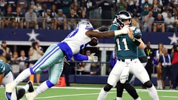 ARLINGTON, TEXAS - OCTOBER 20: Demarcus Lawrence #90 of the Dallas Cowboys sacks Carson Wentz #11 of the Philadelphia Eagles and forces a fumble in the first quarter at AT&T Stadium on October 20, 2019 in Arlington, Texas. (Photo by Richard Rodriguez/Getty Images)