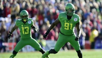 January 1, 2015; Pasadena, CA, USA; Oregon Ducks linebacker Tony Washington (91) and defensive back Troy Hill (13) against the Florida State Seminoles in the 2015 Rose Bowl college football game at Rose Bowl. Mandatory Credit: Gary A. Vasquez-USA TODAY Sports