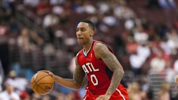 Apr 10, 2013; Philadelphia, PA, USA; Atlanta Hawks guard Jeff Teague (0) brings the ball up court during the fourth quarter against the Philadelphia 76ers at the Wells Fargo Center. The Hawks defeated the Sixers 124-101. Mandatory Credit: Howard Smith-USA TODAY Sports