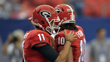 Sep 3, 2016; Atlanta, GA, USA; Georgia Bulldogs quarterback Greyson Lambert (11) hugs quarterback Jacob Eason (10) prior to the 2016 Chick-Fil-A Kickoff game against the North Carolina Tar Heels at Georgia Dome. Mandatory Credit: Dale Zanine-USA TODAY Sports