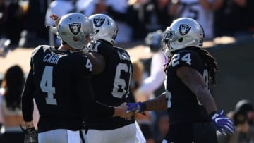 OAKLAND, CA - DECEMBER 03: Marshawn Lynch #24 of the Oakland Raiders celebrates with Derek Carr #4 after scoring on a 51-yard run against the New York Giants during their NFL game at Oakland-Alameda County Coliseum on December 3, 2017 in Oakland, California. (Photo by Thearon W. Henderson/Getty Images)