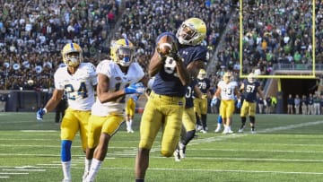 SOUTH BEND, IN - OCTOBER 13: Miles Boykin #81 of the Notre Dame Fighting Irish catches a touchdown pass against Dane Jackson #11 of the Pittsburgh Panthers to take the lead in the second half at Notre Dame Stadium on October 13, 2018 in South Bend, Indiana. (Photo by Quinn Harris/Getty Images)