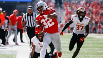 Ohio State Buckeyes running back TreVeyon Henderson (32) fights to stay in bounds as Maryland Terrapins defensive back Nick Cross (3) and Maryland Terrapins defensive back Lavonte Gater (37) pressure during the first quarter of a NCAA Division I football game between the Ohio State Buckeyes and the Maryland Terrapins on Saturday, Oct. 9, 2021 at Ohio Stadium in Columbus, Ohio.Cfb Maryland Terrapins At Ohio State Buckeyes