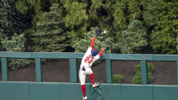 Apr 17, 2021; Philadelphia, Pennsylvania, USA; Philadelphia Phillies center fielder Roman Quinn (24) leaps in attempt to catch a home run hit by St. Louis Cardinals shortstop Pual DeJong (11) (not pictured) during the third inning at Citizens Bank Park. Mandatory Credit: Gregory Fisher-USA TODAY Sports
