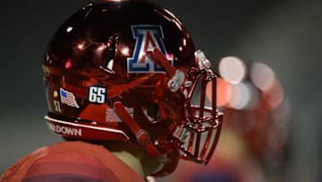 Nov 25, 2016; Tucson, AZ, USA; A general view of an Arizona Wildcats helmet displaying a sticker to honor offensive lineman Zach Hemmila (65) before the Territorial Cup against the Arizona State Sun Devils at Arizona Stadium. Mandatory Credit: Casey Sapio-USA TODAY Sports