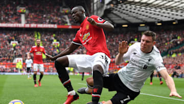 MANCHESTER, ENGLAND - MARCH 10: Eric Bailly of Manchester United and James Milner of Liverpool clash during the Premier League match between Manchester United and Liverpool at Old Trafford on March 10, 2018 in Manchester, England. (Photo by Michael Regan/Getty Images)