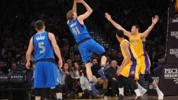 January 26, 2016; Los Angeles, CA, USA; Dallas Mavericks forward Dirk Nowitzki (41) shoots against Los Angeles Lakers forward Larry Nance Jr. (7) during the second half at Staples Center. Mandatory Credit: Gary A. Vasquez-USA TODAY Sports