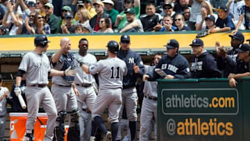 May 22, 2016; Oakland, CA, USA; New York Yankees left fielder Brett Gardner (11) celebrates with teammates after scoring a run against the Oakland Athletics during the sixth inning at the Oakland Coliseum. Mandatory Credit: Kelley L Cox-USA TODAY Sports