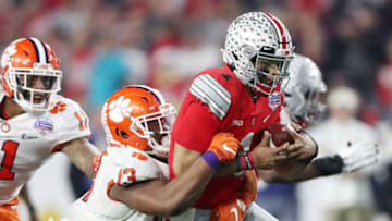 GLENDALE, ARIZONA - DECEMBER 28: Justin Fields #1 of the Ohio State Buckeyes runs the ball against Tyler Davis #13 of the Clemson Tigers in the second half during the College Football Playoff Semifinal at the PlayStation Fiesta Bowl at State Farm Stadium on December 28, 2019 in Glendale, Arizona. (Photo by Matthew Stockman/Getty Images)