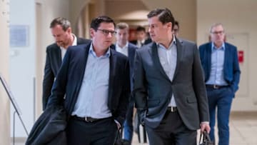 FRANKFURT AM MAIN, GERMANY - MARCH 16: Oliver Leki (SC Freiburg, L) and CEO of DFL Christian Seifert (R) arrive for the general assembly of the German Football League (DFL) on March 16, 2020 in Frankfurt am Main, Germany. Members of the executive committee of the DFL and clubs of the Bundesliga and Second Bundesliga meet to discuss the postponement of all matches until April 2, 2020 and it's consequences due to the ongoing spread of Covid-19 (Coronavirus). (Photo by Thomas Lohnes/Getty Images)