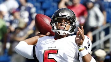 Sep 22, 2013; Foxborough, MA, USA; Tampa Bay Buccaneers quarterback Josh Freeman (5) warms up prior to a game against the New England Patriots at Gillette Stadium. Mandatory Credit: Mark L. Baer-USA TODAY Sports