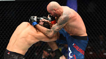 UTICA, NY - JUNE 01: (R-L) Ben Saunders lands a knee to the head of Jake Ellenberger in their welterweight fight during the UFC Fight Night event at the Adirondack Bank Center on June 1, 2018 in Utica, New York. (Photo by Josh Hedges/Zuffa LLC/Zuffa LLC via Getty Images)