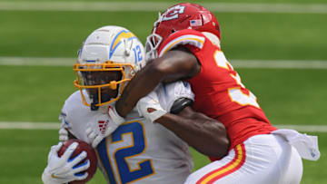 INGLEWOOD, CALIFORNIA - SEPTEMBER 20: Wide receiver Joe Reed #12 of the Los Angeles Chargers is tackled by cornerback Hakeem Bailey #34 of the Kansas City Chiefs during the second quarter at SoFi Stadium on September 20, 2020 in Inglewood, California. (Photo by Harry How/Getty Images)