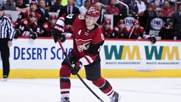Feb 15, 2016; Glendale, AZ, USA; Arizona Coyotes defenseman Oliver Ekman-Larsson (23) shoots and scores a goal in the second period against the Montreal Canadiens at Gila River Arena. Mandatory Credit: Matt Kartozian-USA TODAY Sports