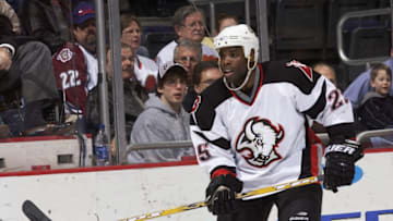 WASHINGTON - MARCH 10: Mike Grier #25 of the Buffalo Sabres eyes the play against the Washington Capitals on March 10, 2004 at the MCI Center in Washington, D.C. The Sabres defeated the Capitals 6-0. (Photo by Mitchell Layton/Getty Images)