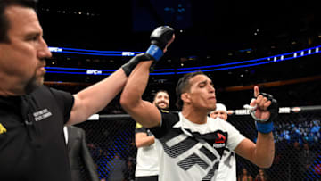 BUFFALO, NY - APRIL 08: Charles Oliveira of Brazil celebrates his rear choke submission victory against Will Brooks in their lightweight bout during the UFC 210 event at KeyBank Center on April 8, 2017 in Buffalo, New York. (Photo by Josh Hedges/Zuffa LLC/Zuffa LLC via Getty Images)