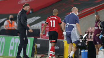 SOUTHAMPTON, ENGLAND - SEPTEMBER 16: Ralph Hasenhuttl with Nathan Redmond of Southampton after he receives treatment before he is replaced during the Carabao Cup Second Round match between Southampton FC and Brentford FC at St. Mary's Stadium on September 16, 2020 in Southampton, England. (Photo by Robin Jones/Getty Images)
