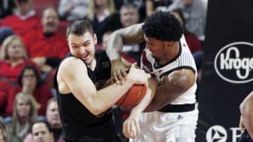 LOUISVILLE, KY - NOVEMBER 16: Malik Williams #5 of the Louisville Cardinals fights for the ball against Ryan Davis #35 of the Vermont Catamounts in the first half of the game at KFC YUM! Center on November 16, 2018 in Louisville, Kentucky. Louisville won 86-78. (Photo by Joe Robbins/Getty Images)